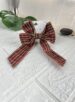 laço de cabelo xadrez vermelho